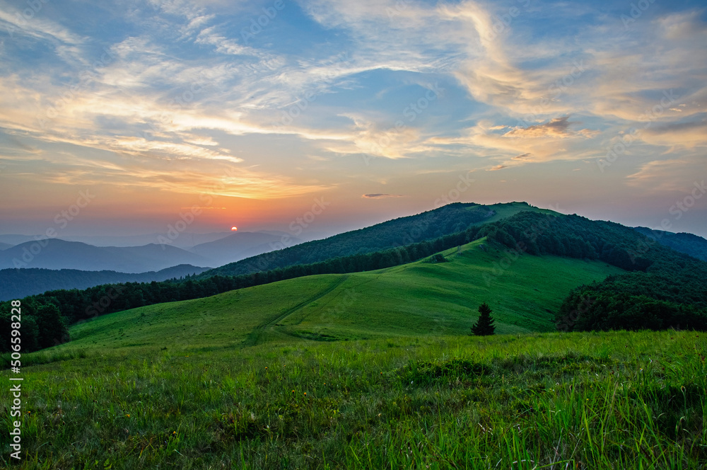 Beautiful sunset on the Vododelny ridge in the Carpathians in summer. Ukraine Beautiful sunset on the Vododelny ridge in the Carpathians in summer. Ukraine