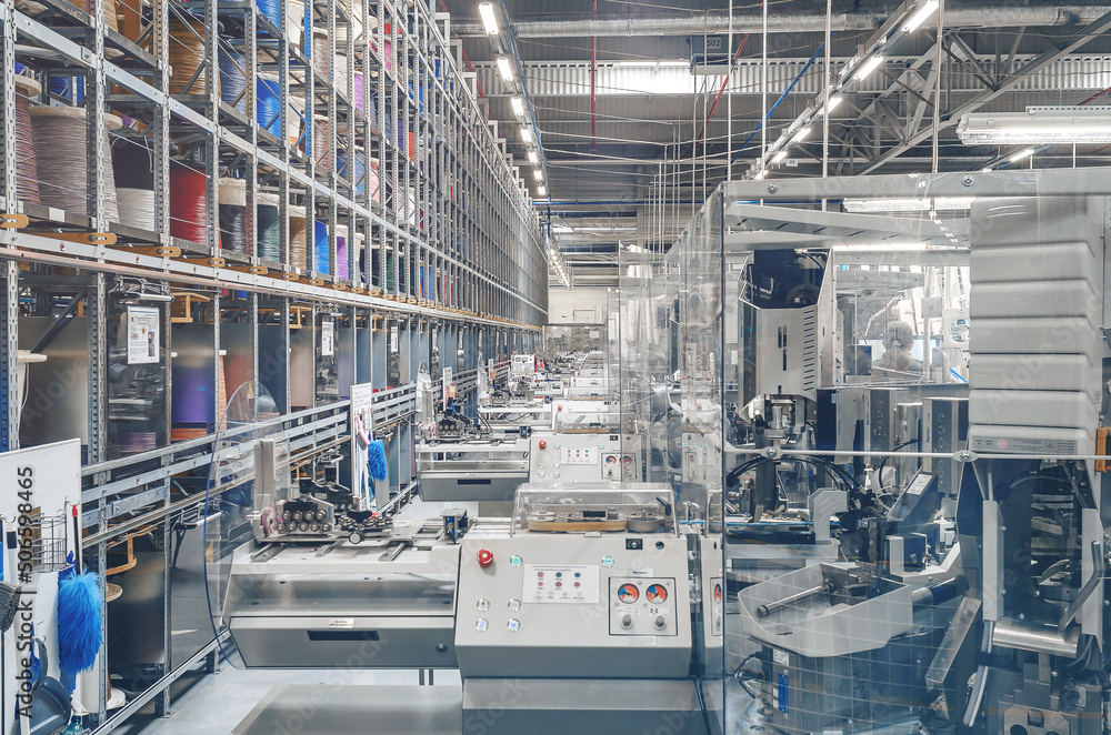 Interior of an industrial workshop or shop inside for the production of automotive wiring.