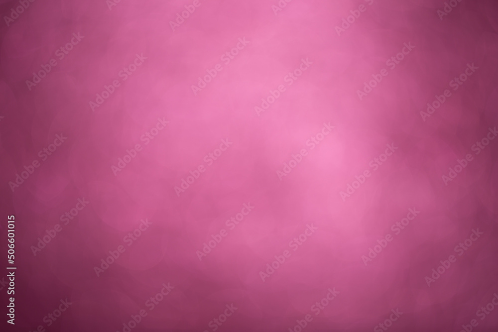 Pink bokeh background. Festive, Christmas shiny background. Sparkling pink light.