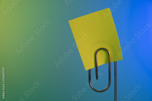 Sticky note and paperclip