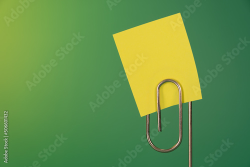 Sticky note and paperclip