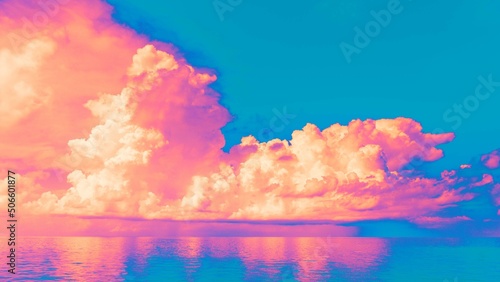 Neon bright pink and yellow clouds against blue sky. 
