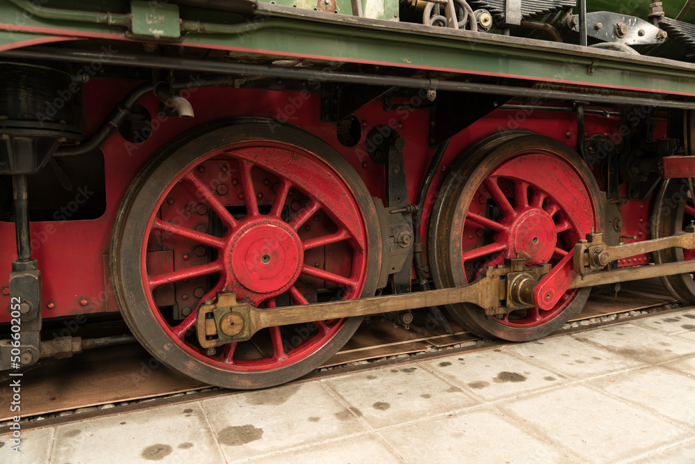 old metal locomotive wheels in red
