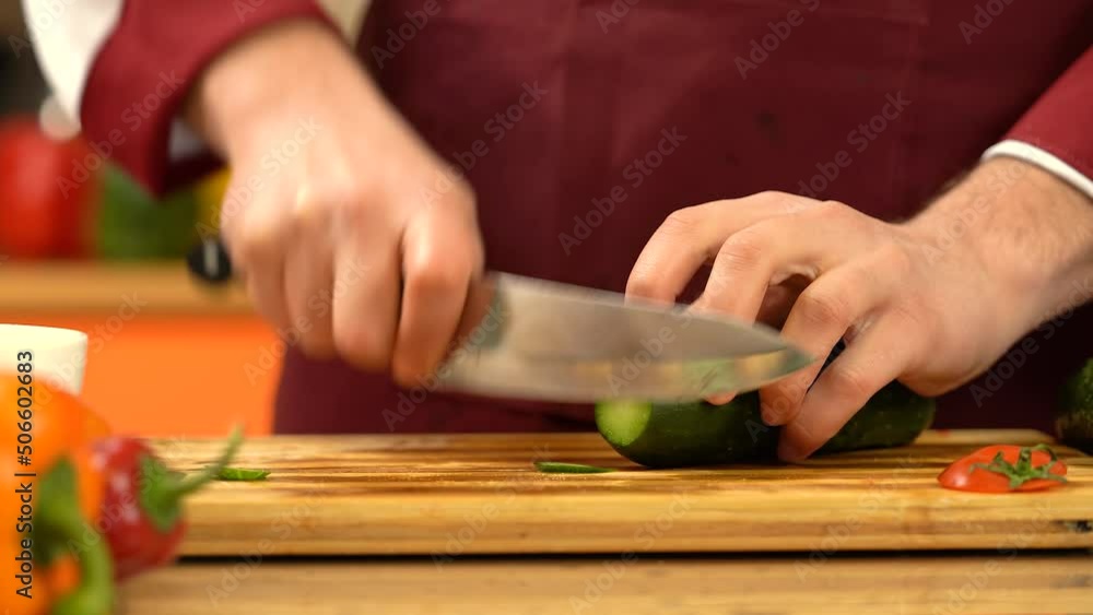 Man cutting fresh
cucumber. Chef slicing
cucumber with sharp knife. Preparing Vegetable for cooking for salad. Eco food. Man cutting fresh
cucumber. Chef slicing
cucumber with sharp knife. Preparing Vegetable for cooking for salad. Eco food.