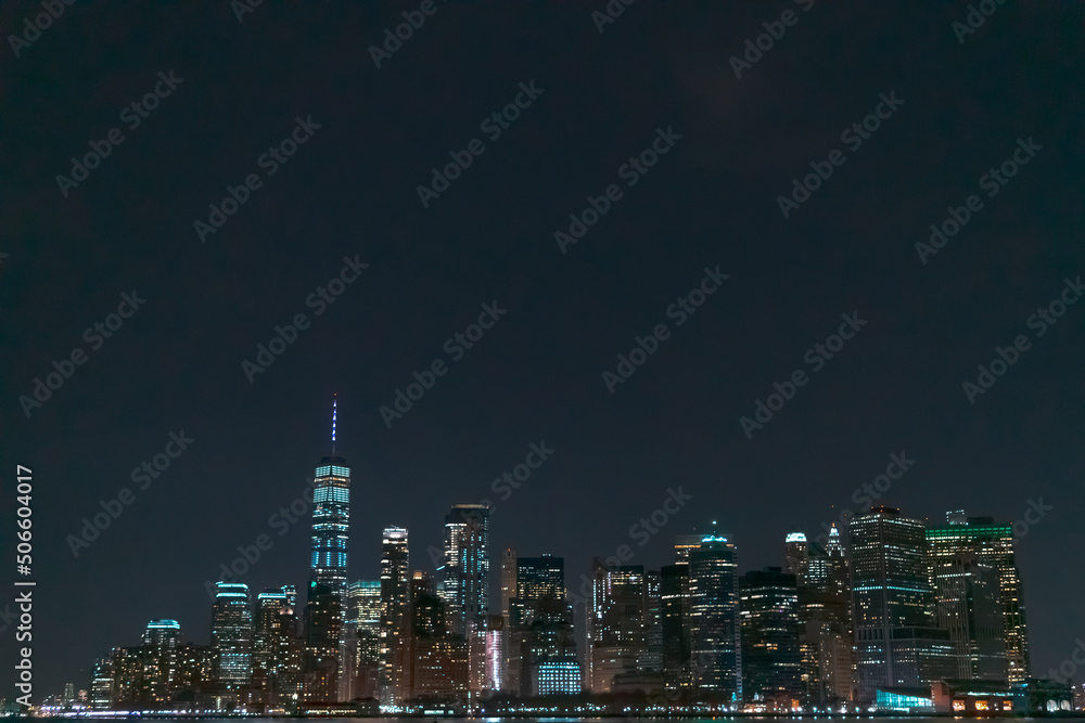Manhattan Skyline at night. Part of New York city viewed from Hudson river