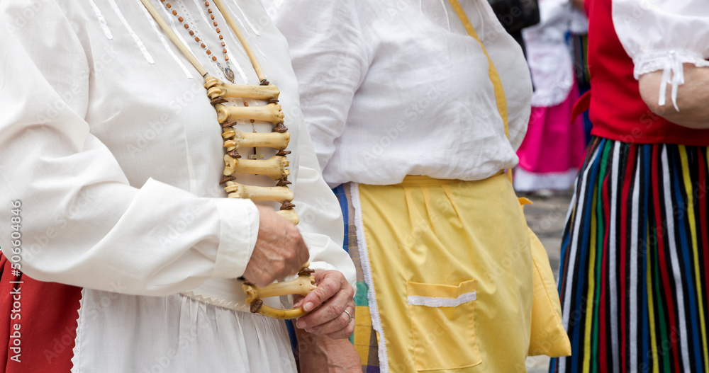 playing the huesera in a pilgrimage on the island of Gran Canaria typical musical percussion instrument of the Canary Islands is used to accompany the cante, made of lamb or kid bones