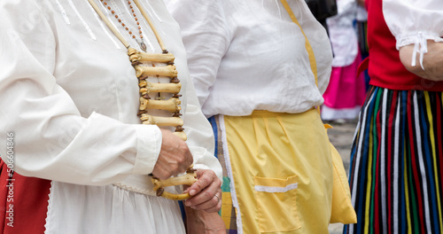 playing the huesera in a pilgrimage on the island of Gran Canaria typical musical percussion instrument of the Canary Islands is used to accompany the cante, made of lamb or kid bones