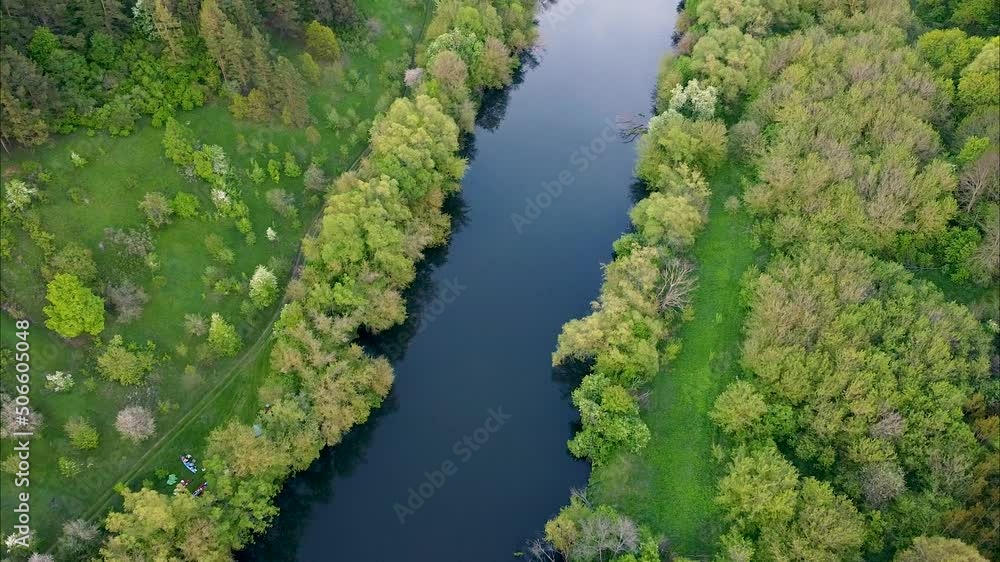 View of the river from above. Flight over water and forest trees from a height. Epic panoramic shot. Spring flood. Travel by kayak. Green background View of the river from above. Flight over water and forest trees from a height. Epic panoramic shot. Spring flood. Travel by kayak. Green background