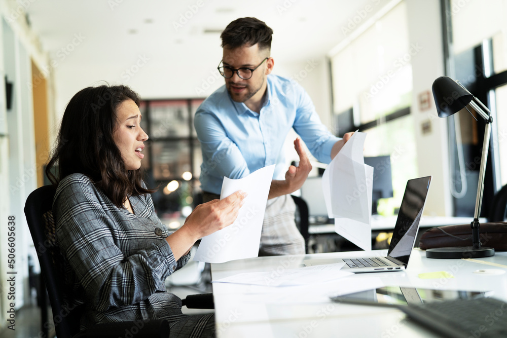 Colleagues arguing in office. Angry businessman yelling at his collegue. Colleagues arguing in office. Angry businessman yelling at his collegue.