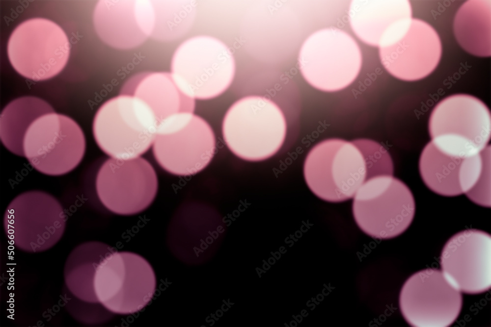 Defocused pink lights on a black background. Defocused pink lights on a black background.