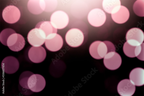 Defocused pink lights on a black background.