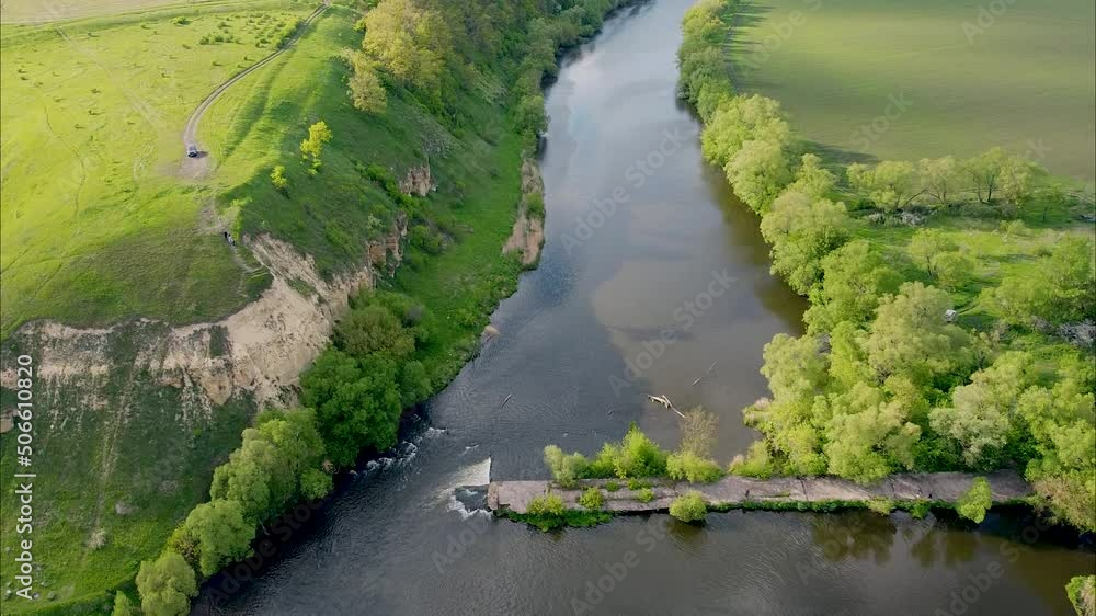 View of the river from above. Flight over water and forest trees from a height. Epic panoramic shot. Spring flood. Travel by kayak. Green background View of the river from above. Flight over water and forest trees from a height. Epic panoramic shot. Spring flood. Travel by kayak. Green background