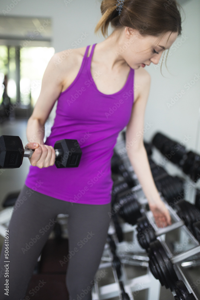 The girl is engaged in fitness in the gym. Playing sports in the gym. A set of exercises for the back. Women's health. Weight loss and a healthy body.
The girl is engaged in fitness in the gym. Playing sports in the gym. A set of exercises for the back. Women's health. Weight loss and a healthy body.