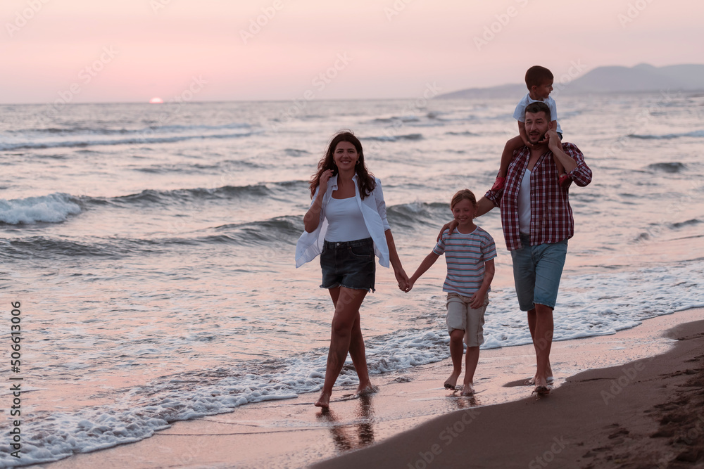 Family gatherings and socializing on the beach at sunset. The family walks along the sandy beach. Selective focus 