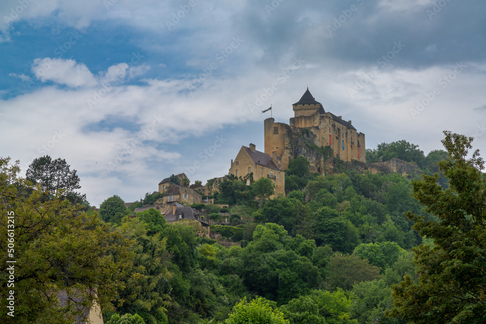 view of the castle in Castelnaud-la-Chapelle in the Dordogne Valley under an overcast sky