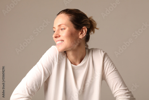 Studio shot of good-looking beautiful woman isolated against yellow studio wall. © face_reader_img