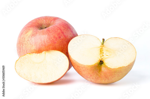 An apple cut in half to see the soft white flesh looks juicy and appetizing. isolated on white background.
