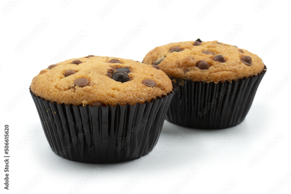 Two Chocolate chip muffins cake isolated on white background Two Chocolate chip muffins cake isolated on white background