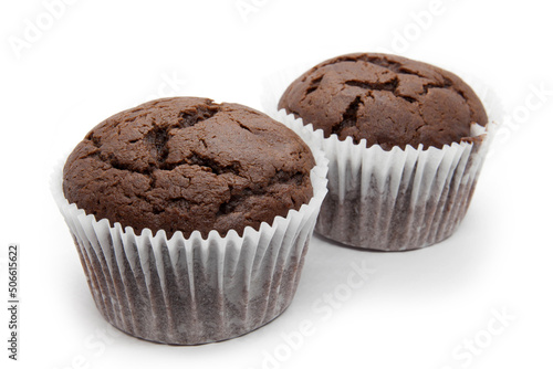 Two chocolate muffins with napkin on the white background
