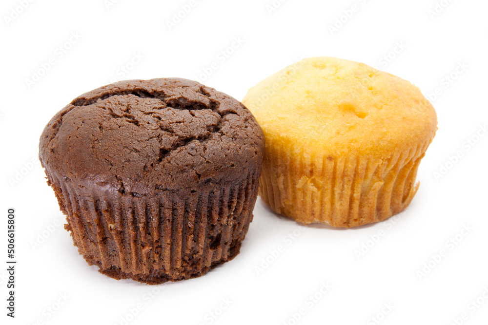 Vanilla and Chocolate muffins on the white background Vanilla and Chocolate muffins on the white background