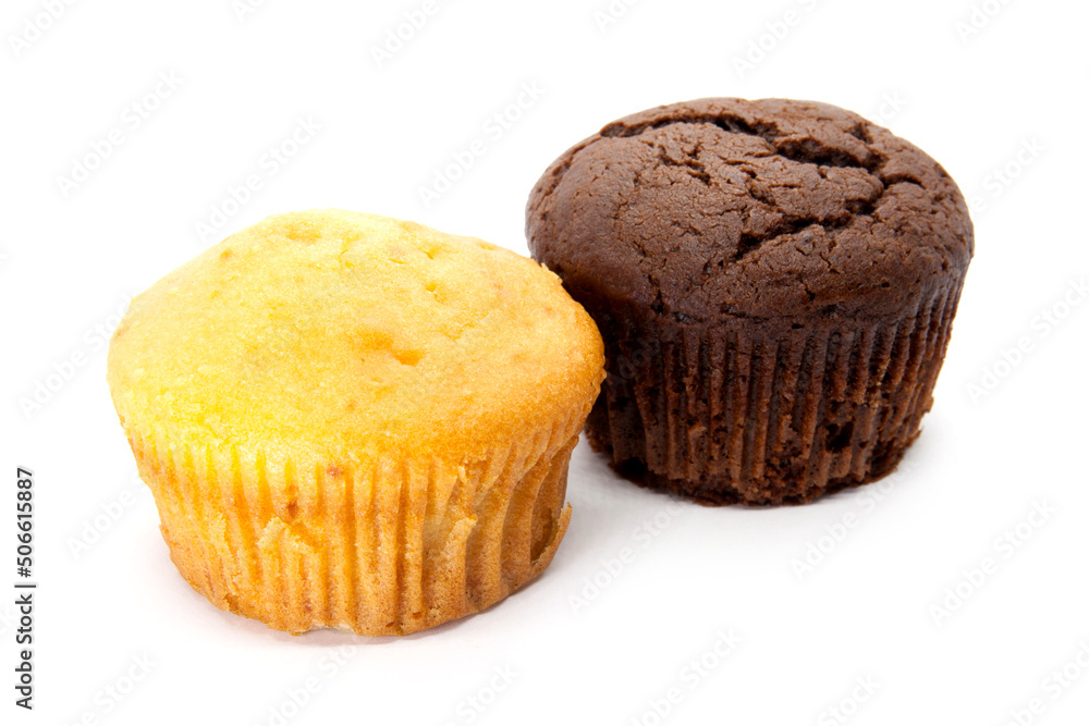 Chocolate and vanilla muffins on the white background Chocolate and vanilla muffins on the white background