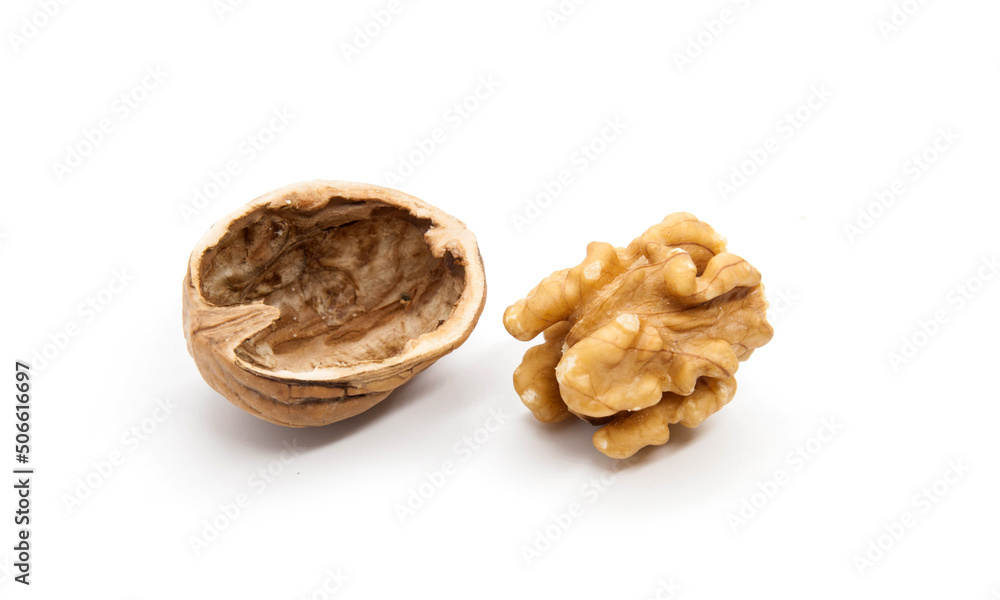 Broken walnuts on white Broken walnuts on white