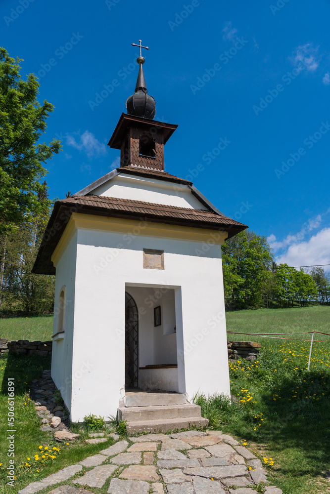 Baroque chapel with wooden roof in beautiful green nature