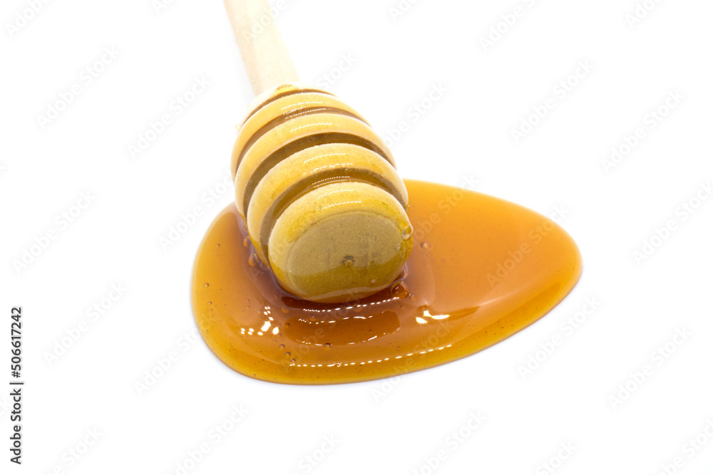 Date syrup and drops on white background - face view Date syrup and drops on white background - face view