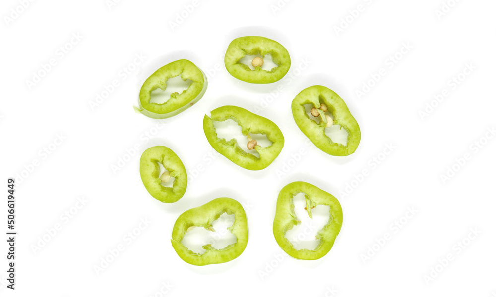 Sliced green spicy chili pepper in a white