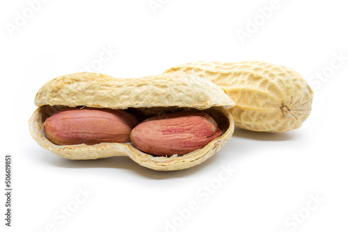 Two dried peanuts in the shell isolated on white background