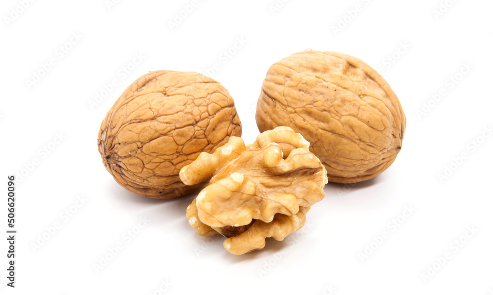 Walnuts and cracked walnut on white background Walnuts and cracked walnut on white background