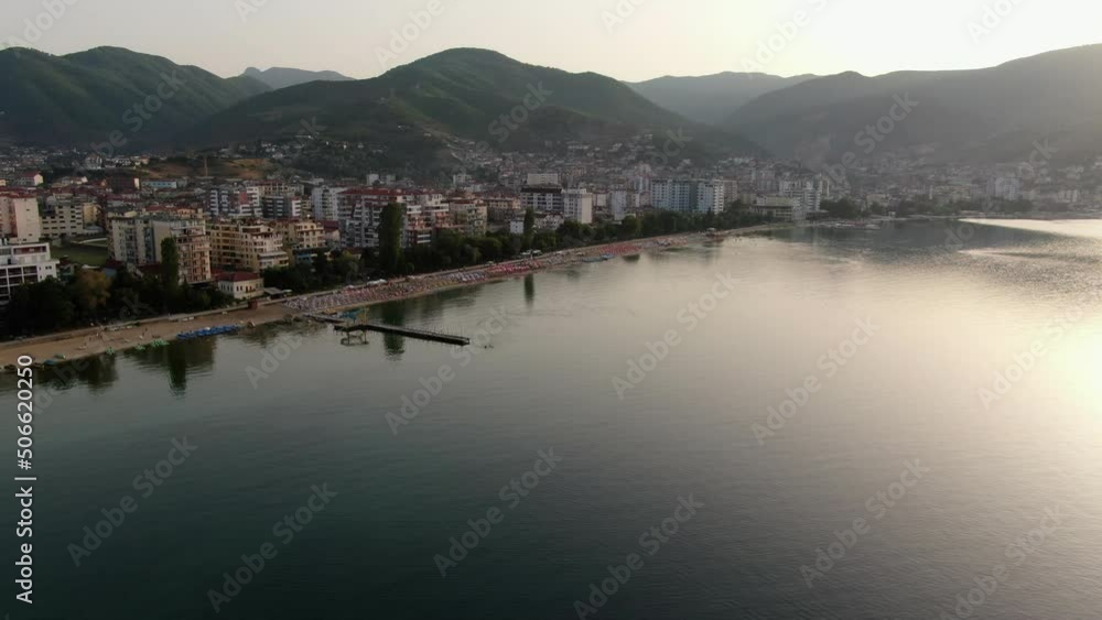 Beautiful view from the air of Pogradec, a town in Albania, Europe by lake Ohrid with mountains in the background during sunset Beautiful view from the air of Pogradec, a town in Albania, Europe by lake Ohrid with mountains in the background during sunset
