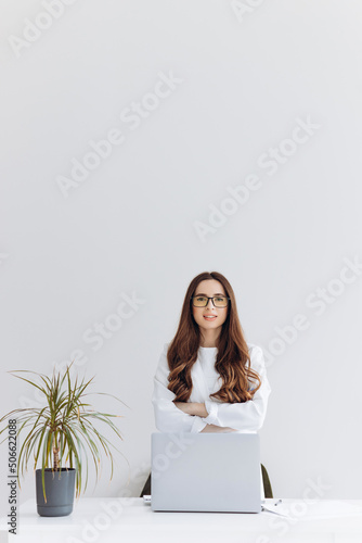 Happy relaxed confident young businesswoman