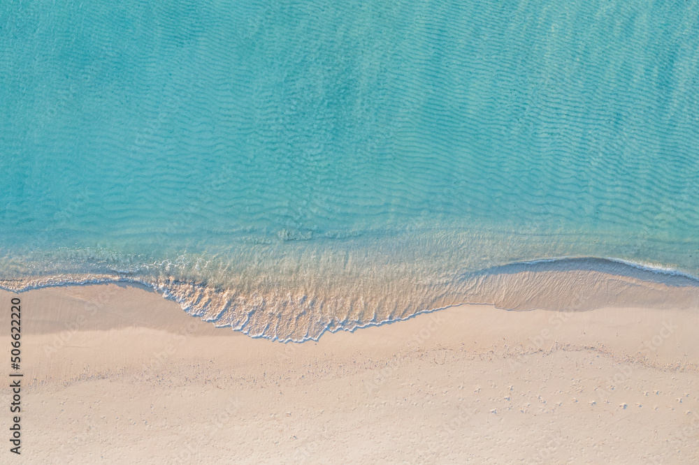 Relaxing aerial beach scene, summer vacation holiday template banner. Waves surf with amazing blue ocean lagoon, sea shore, coastline. Perfect aerial drone top view. Peaceful bright beach, seaside