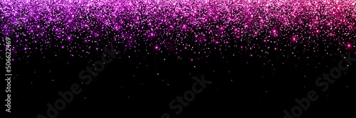Fotografiet Wide pink violet falling glitter particles on black background