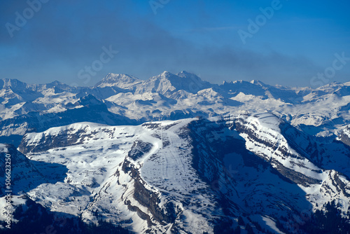 Aerial view over the Swiss Alps with Churfirsten and Toggenburg Valley seen from S  ntis peak at Alpstein Mountains on a sunny spring day. Photo taken April 19th  2022  S  ntis  Switzerland.