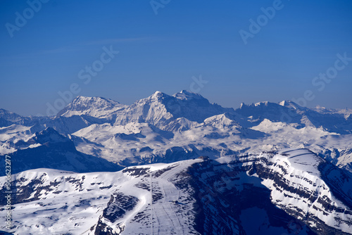 Aerial view over the Swiss Alps with Churfirsten and Toggenburg Valley seen from Säntis peak at Alpstein Mountains on a sunny spring day. Photo taken April 19th, 2022, Säntis, Switzerland.