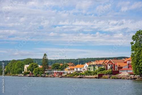 Houses with a lake view on the shore of Lake Vättern in the town of Hjo in Sweden