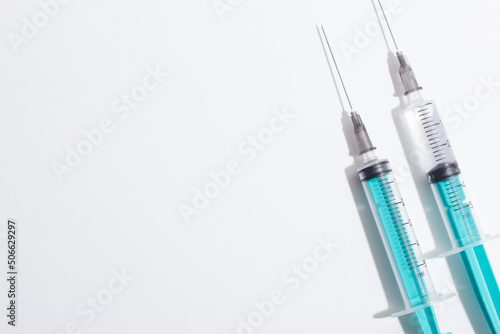 Medical syringe on a white background. A syringe for injection. The concept of health and beauty