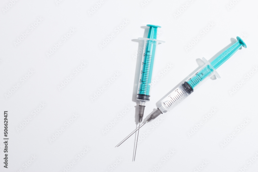 Medical syringe on a white background. A syringe for injection. The concept of health and beauty Medical syringe on a white background. A syringe for injection. The concept of health and beauty