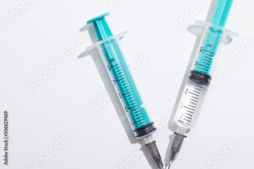 Medical syringe on a white background. A syringe for injection. The concept of health and beauty