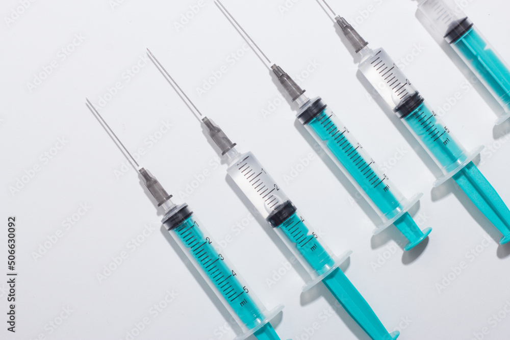 Medical syringe on a white background. A syringe for injection. The concept of health and beauty Medical syringe on a white background. A syringe for injection. The concept of health and beauty