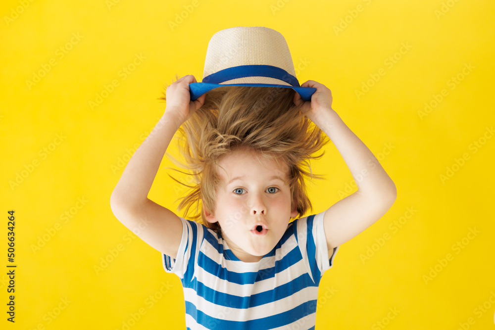 Surprised child against yellow background Surprised child against yellow background