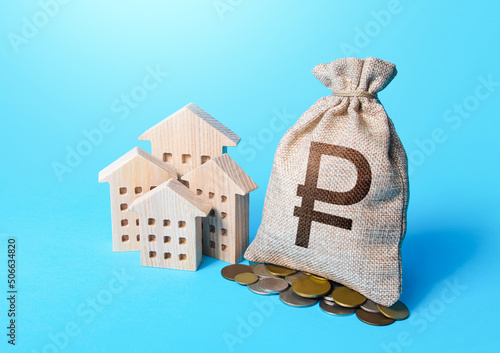 Houses and dollar money bag. Real estate investment and rental b