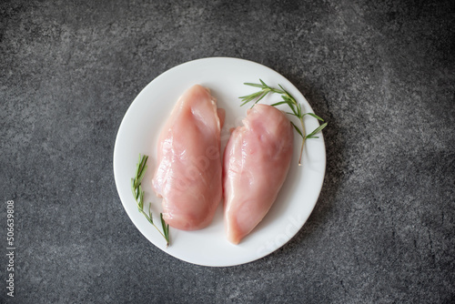 Raw chicken fillet on stone background