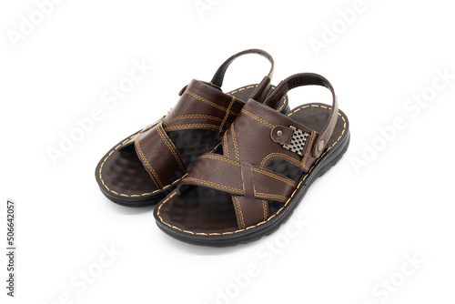 Pair of brown leather fashion sandals close-up on a white background