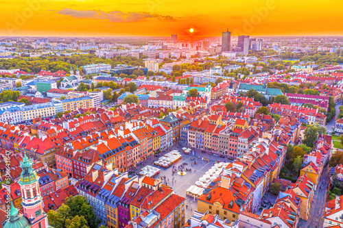 Beautiful panoramic aerial drone skyline sunset view of the Warsaw City Centre with skyscrapers of the Warsaw City and Warsaw's old town with a market square and a mermaid statue, Poland, EU