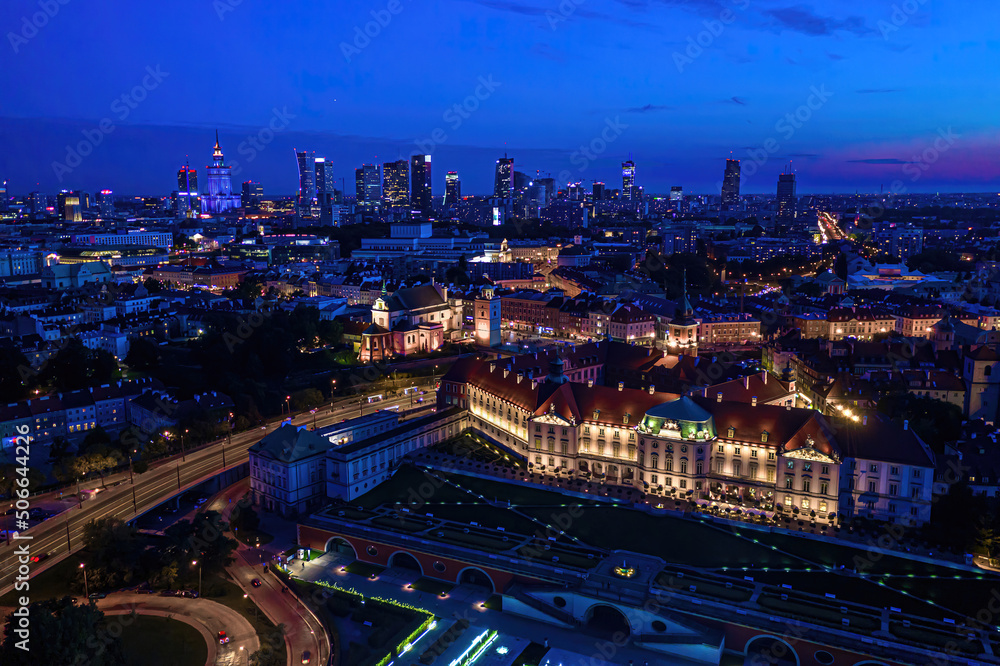 City of Warsaw by night in Poland, Castle Square in the Old Town, picturesque urban landscape of the capital city. Travel destination background