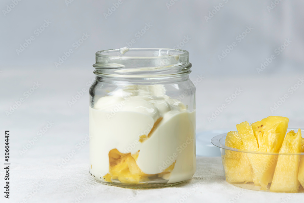 fresh natural homemade organic yogurt in glass bottle on white table. fresh natural homemade organic yogurt in glass bottle on white table.