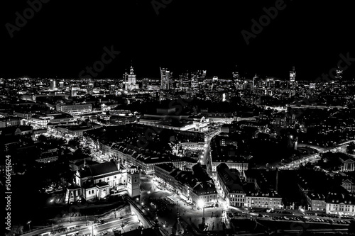 Black and white Aerial view of old buildings, castles and a church in the old city of Warsaw. Cityscape of old buildings and architecture in the old town in Warsaw. Night time